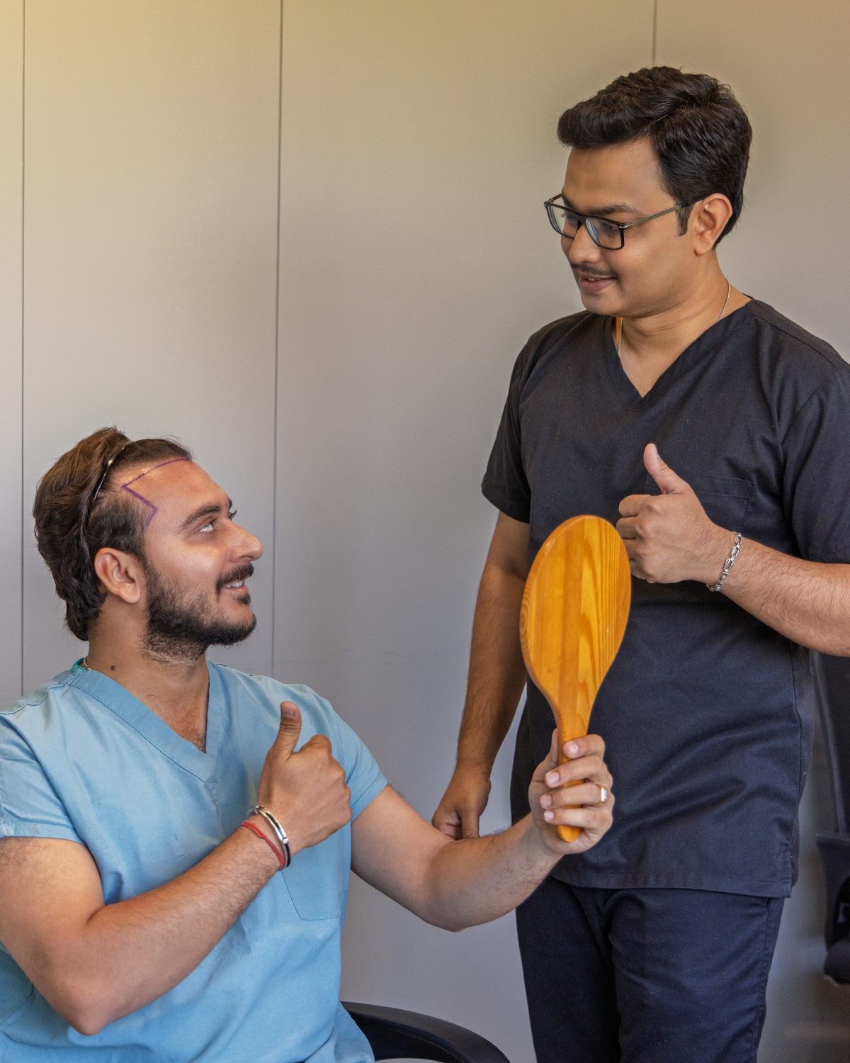 Dr. Diwakar Sharma discussing hairline design with a patient